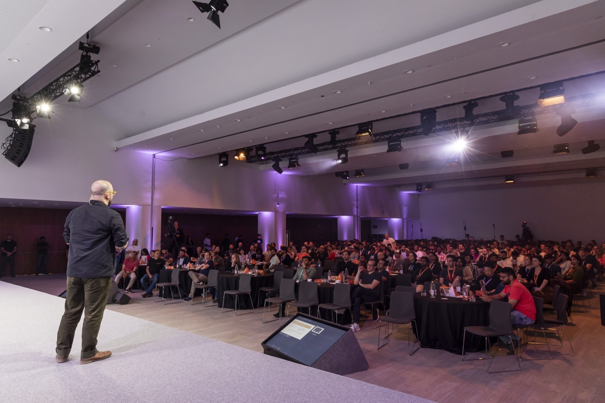 Speaking to a packed conference hall